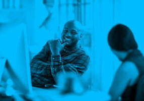 Man and woman talking in modern office